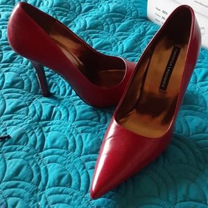 Red leather pumps